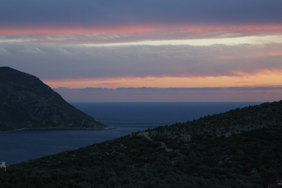 View of Kalamar Bay at dusk from the pool terrace of Kalkan holiday villa