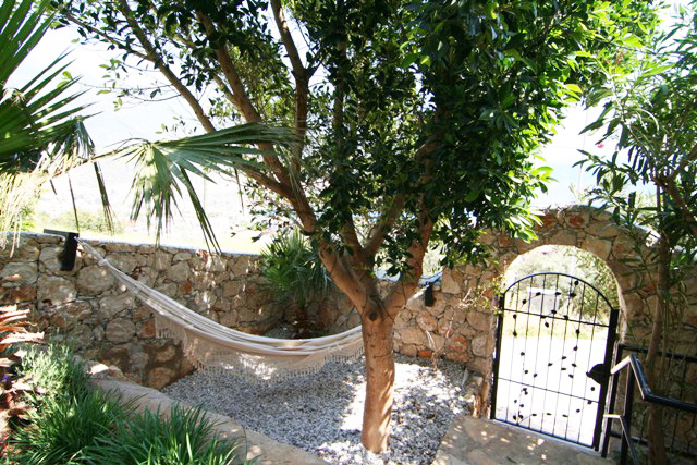 Relax in large private hammock in the shade, with sea views