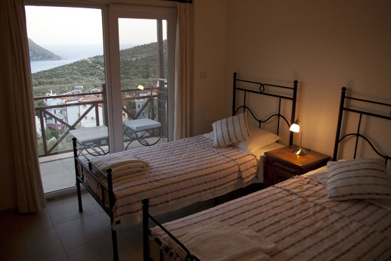 Twin bedroom in Kalkan villa with sea views and balcony