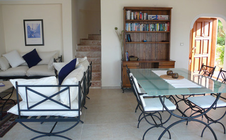 Open plan living area and dining table seating six