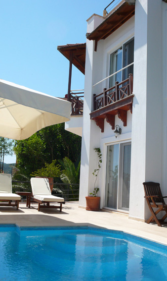 Large umbrella provides shade by private pool